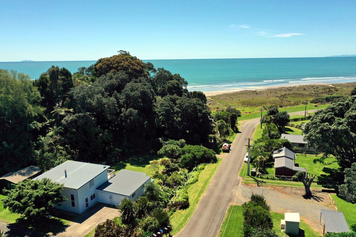 Aerial view of the home and the Ohiwa coastline